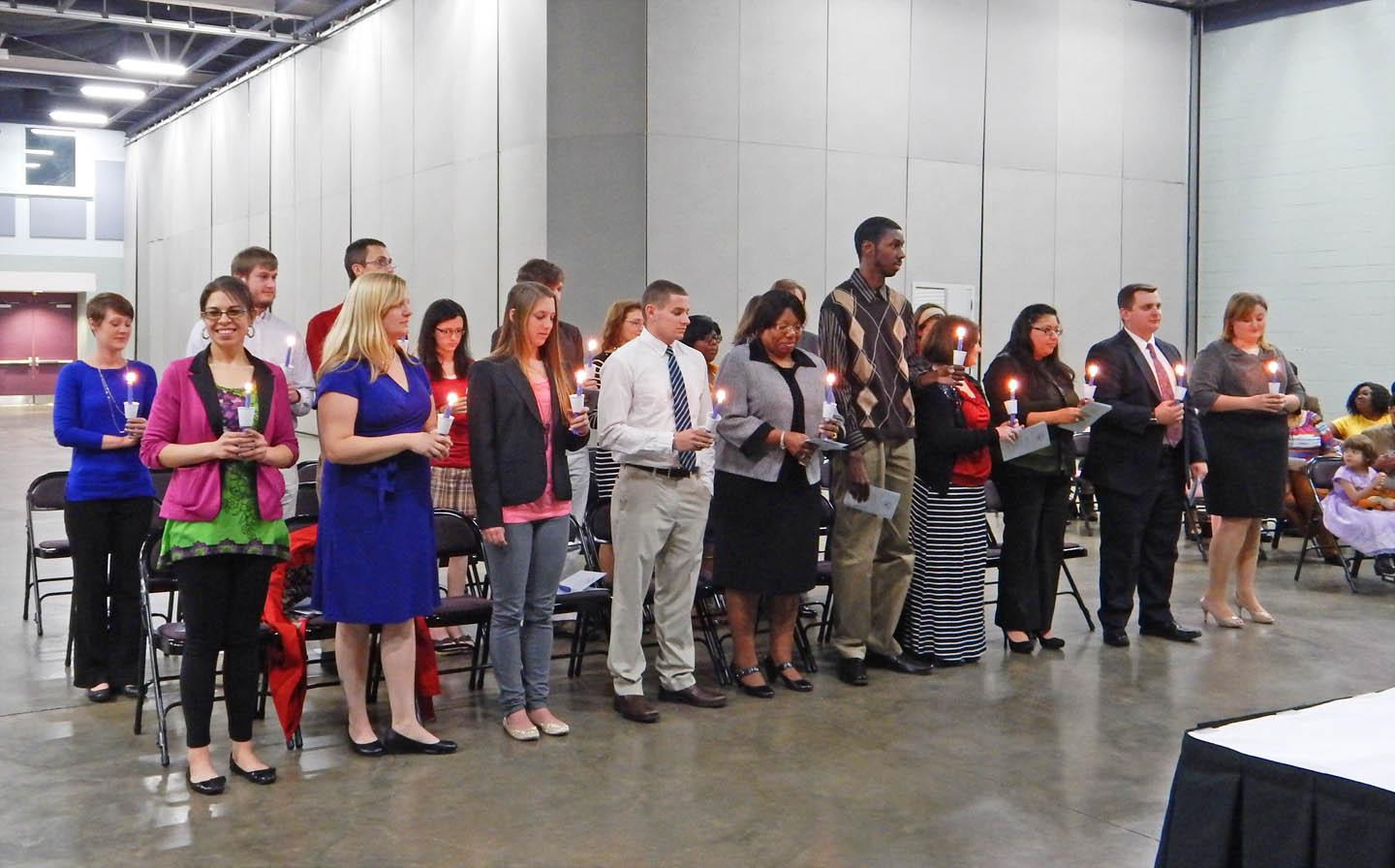 Click to enlarge,  Central Carolina Community College inducted new members into its Beta Sigma Phi Chapter of the Phi Theta Kappa International Honor Society at a ceremony Feb. 25 in the Dennis A. Wicker Civic Center. PTK is the official honor society for two-year colleges and the largest honor society in American higher education. During the ceremony, the inductees lit candles, symbolizing knowledge, and pledged themselves to academic excellence, service, and leadership. For more information about Phi Theta Kappa at <a href='http://nzusojb.lookforstudies.com'>推荐正规买球平台</a>, visit the college's Web site, nzusojb.lookforstudies.com, click on 'A-Z Index, then 'P' for Phi Theta Kappa Honor Society. 